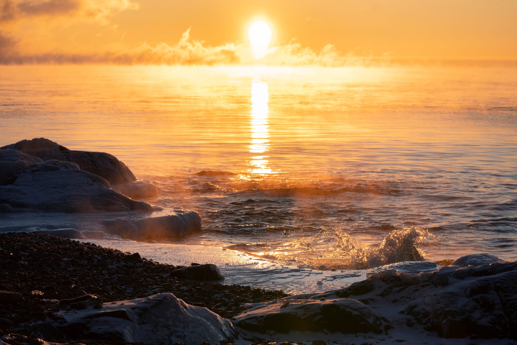 Sun rises over Lake Superior in Duluth, Minn., on a winter morning.