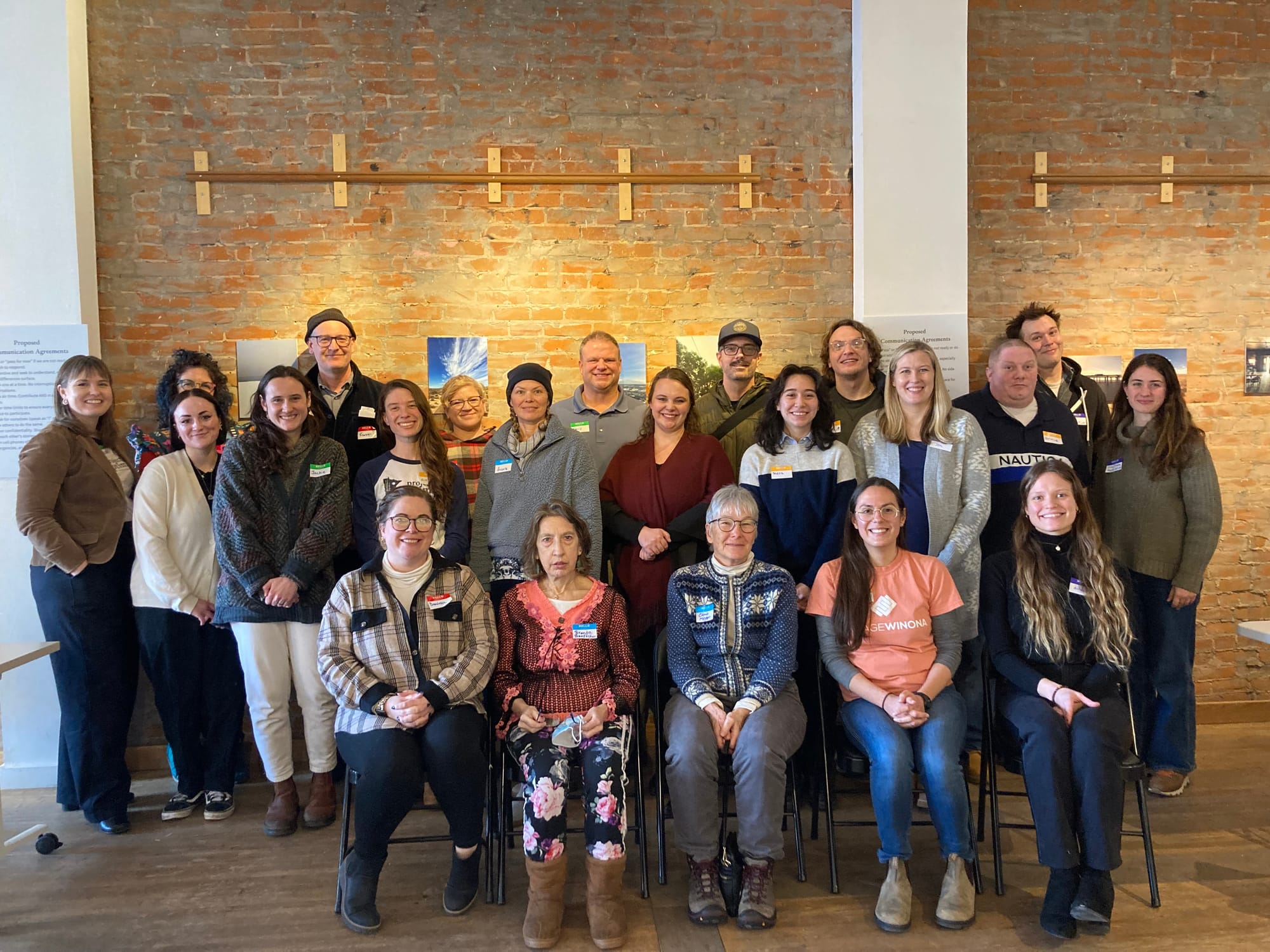 A group of people pose for a photo after an event