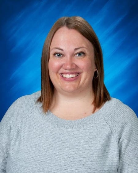 Woman poses for a professional headshot.