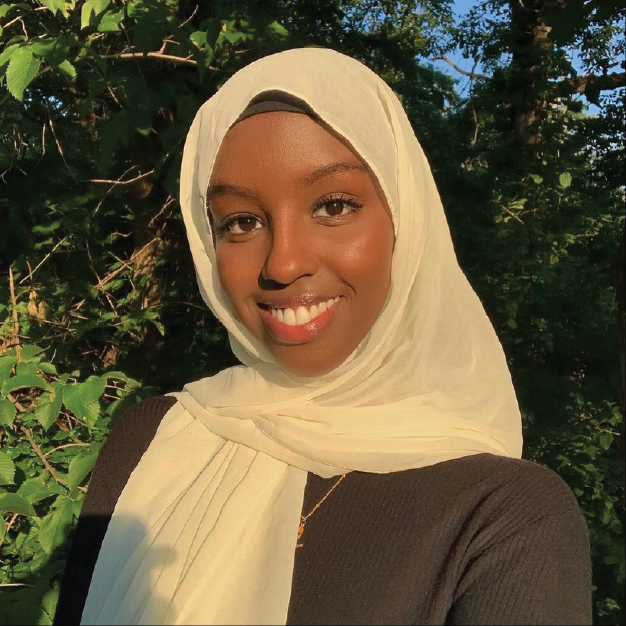 Photo of Wasima Farah, Somali artist wearing a white hijab. 