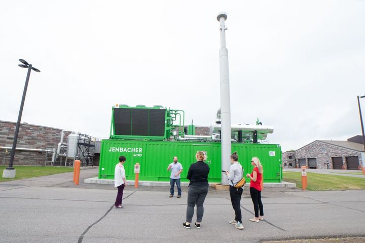 A bright green generator shown on Monday, June 13, 2022, is one of two that burn biogas at the St. Cloud Nutrient, Energy and