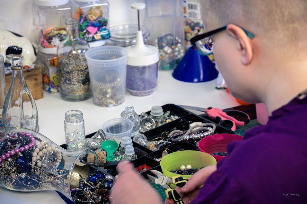 Phena Keil sorts through items collected for her artwork in Fergus Falls, Minn., on May 5, 2023. (R.C. Drews for Project Optimist)