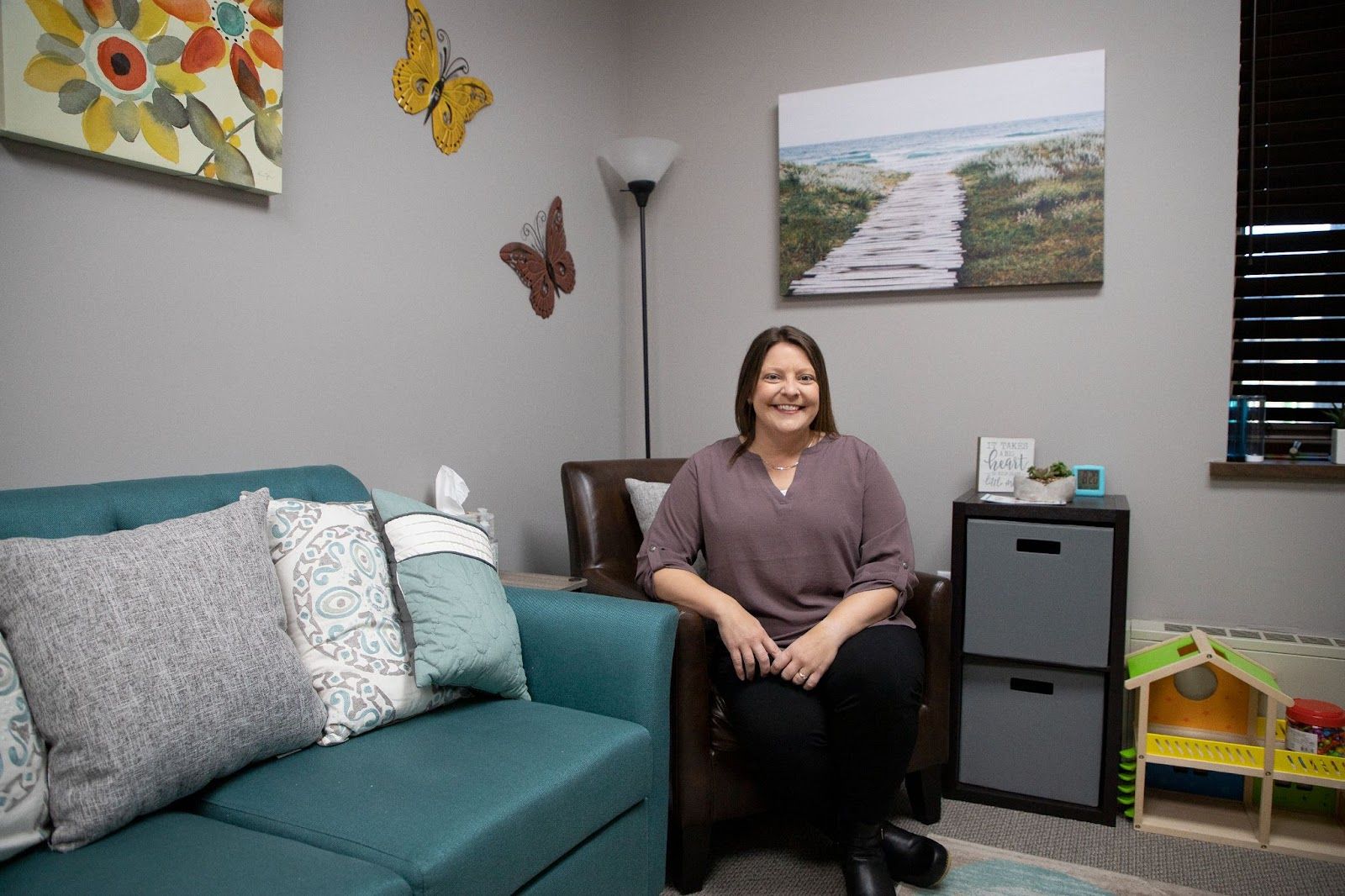 Ellison Center Executive Director Tracy Schreifels poses for a photo in her St. Cloud office on Wednesday, Oct. 12, 2022. (Colleen Harrison for Project Optimist)