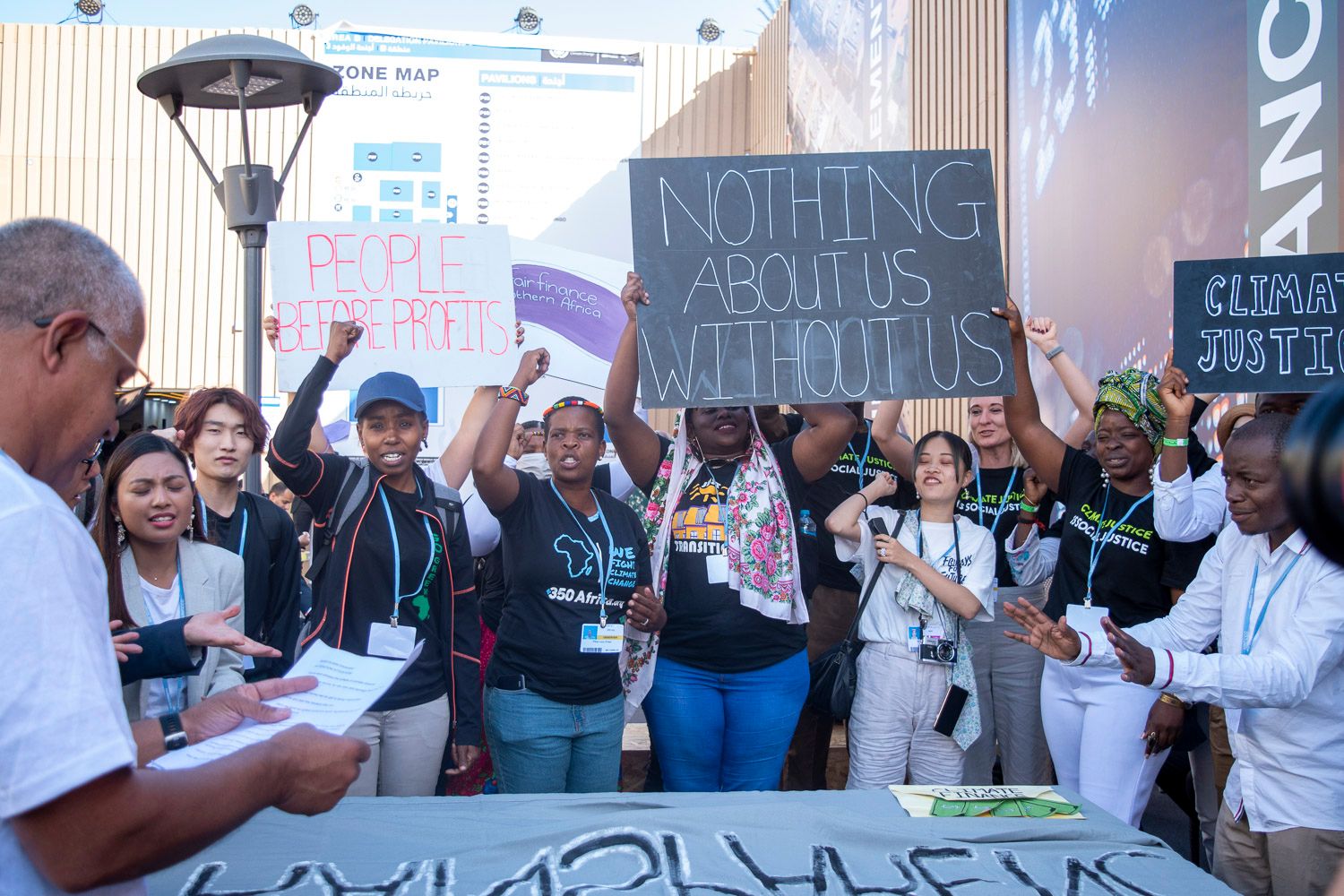 A group of protestors at COP27 in Sharm el Sheikh, Egypt, chanted 'nothing about us without us' in reference to BIPOC communities often being ignored by stakeholders in climate finance discussions during the conference in November 2022. (Courtesy of Kate Fenske)
