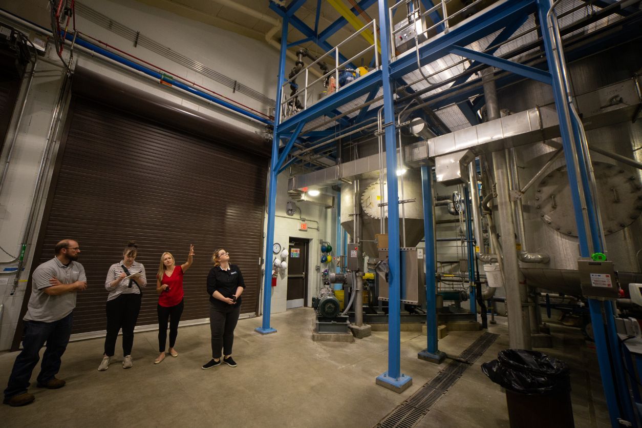 St. Cloud Public Services Director Tracy Hodel (third from left) talks about how the city creates struvite, a compound rich in phosphorous, from recovered nutrients at the St. Cloud facility on Monday, June, 13, 2022. (Shannon Rathmanner for Project Optimist)